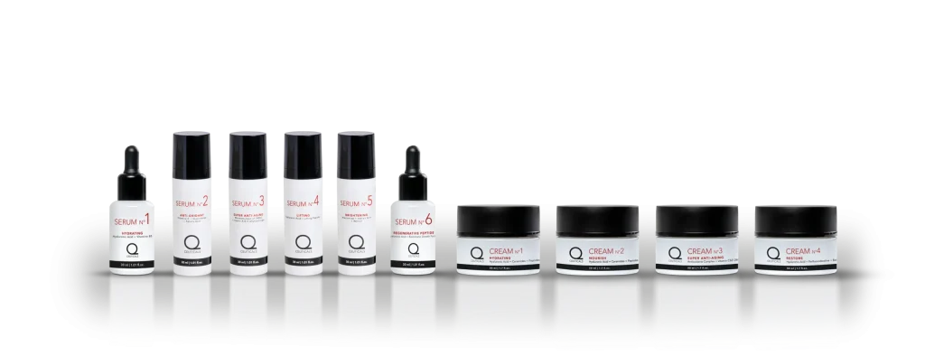 A collection of skincare products featuring sophisticated creams and serums, elegantly packaged in bottles and jars, is being showcased. The bottles are adorned with black caps and white labels displaying red and black text, while the jars feature sleek black lids accompanied by minimalist white labels. These luxurious cosmetics are meticulously arranged against a simple backdrop, highlighting the brand's refined aesthetic.