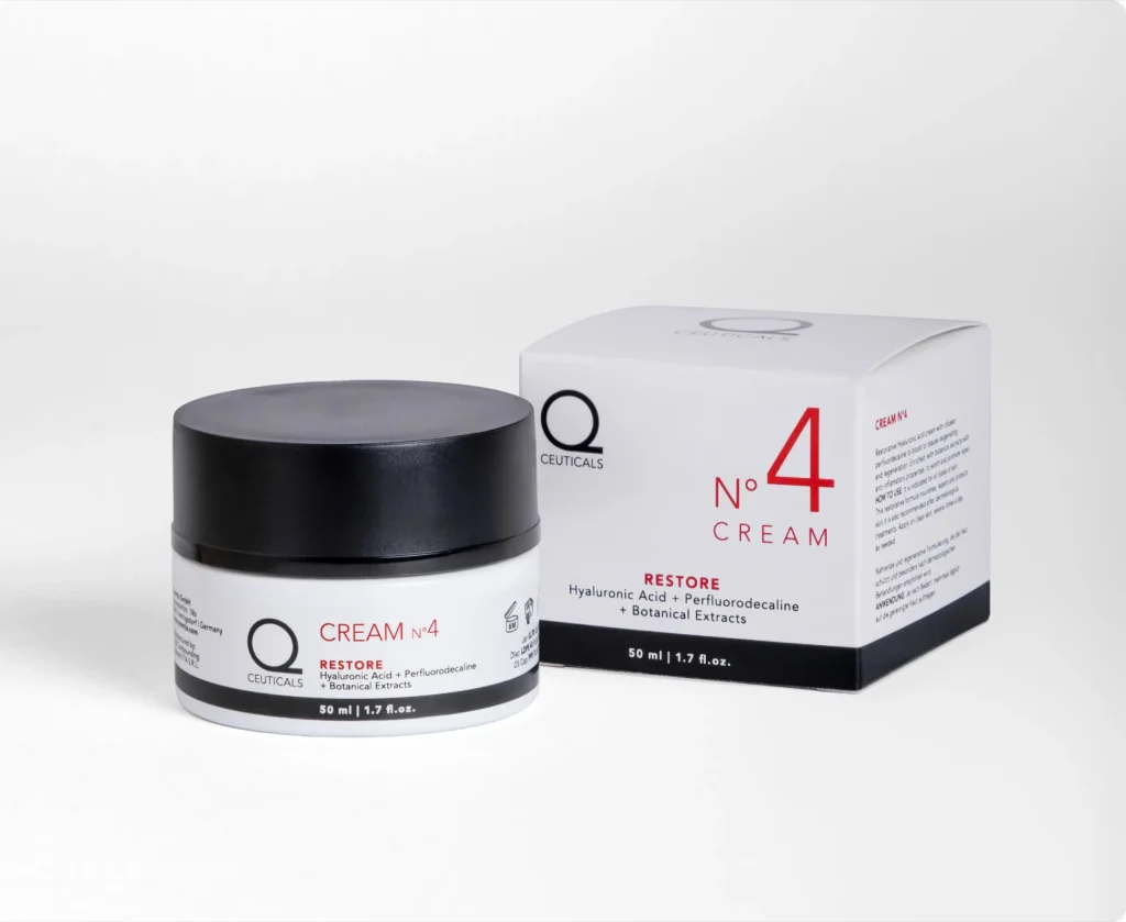 Introducing the Q Ceuticals No. 4 Restore Cream, a premium cosmetic product that comes in both a jar and box, showcasing a sophisticated combination of cutting-edge ingredients like hyaluronic acid, pefuteroluceline, and botanical extracts. The elegant black-and-white jar is perfectly paired with the white box adorned with striking red and black text. Available in a 50 ml / 1.7 fl. oz. size, this cream represents the excellence of our cosmetic company’s commitment to quality and design.
